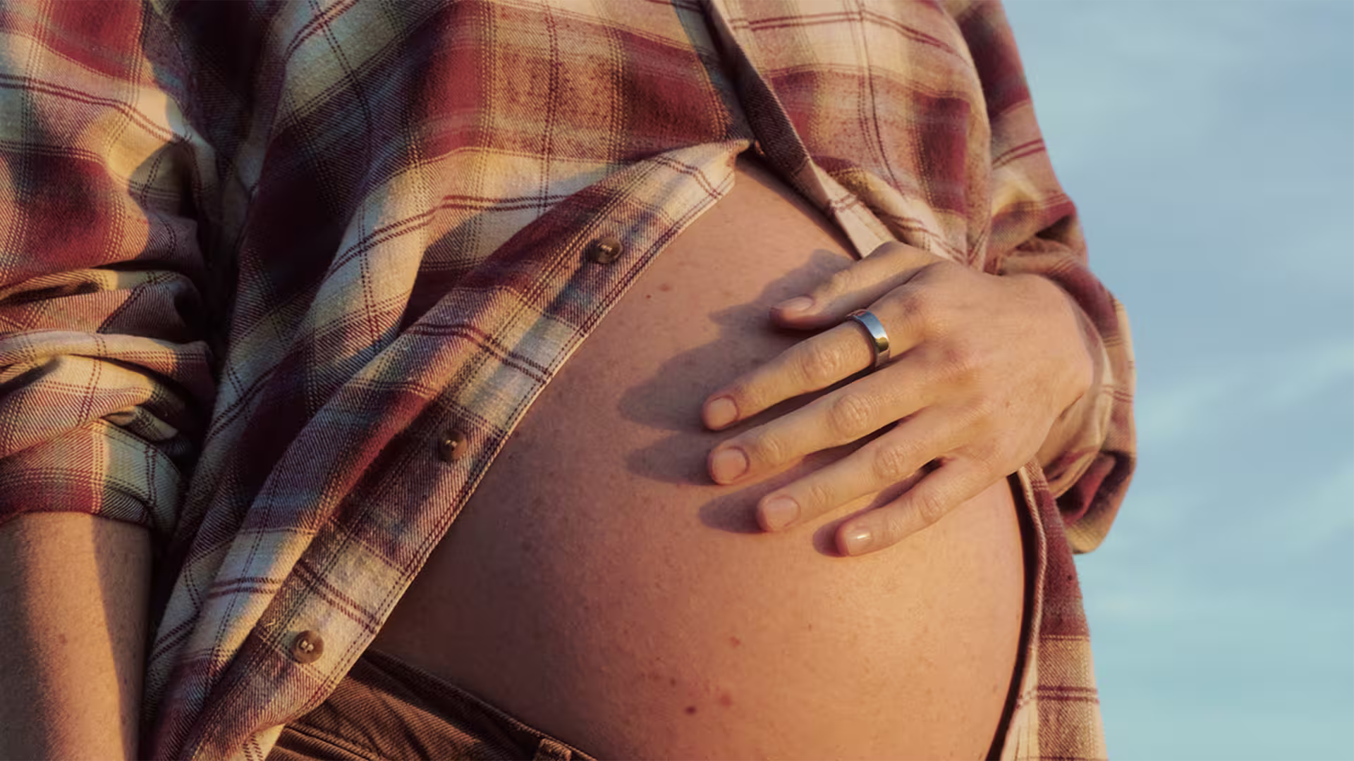 Temporal trajectories in sleep, temperature trends, cardiorespiratory, and activity metrics measured via Oura Ring during pregnancy: large-scale observational analysis